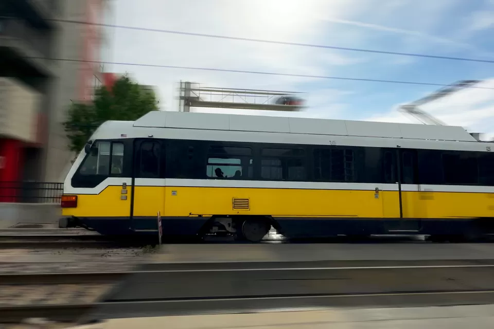 Blurred image of speeding DART light rain train in Dallas, Texas